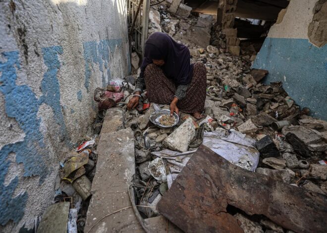 Palestinians facing starvation pick food scraps from waste