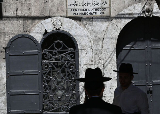 Posing as priest, reporter is spat at many times in Israel