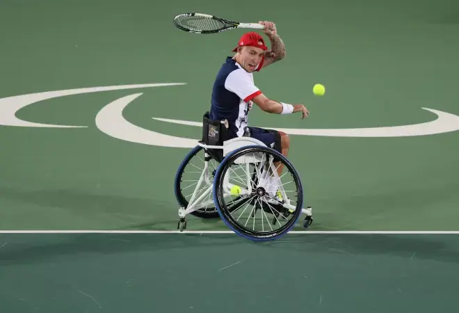 What does an 18-time wheelchair tennis Grand Slam champion feed his dog?