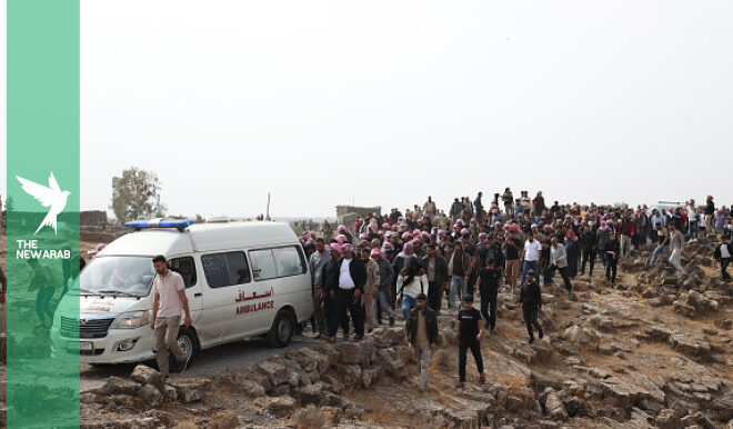 Syrians bury victims of Jordanian airstrike massacre in Daraa